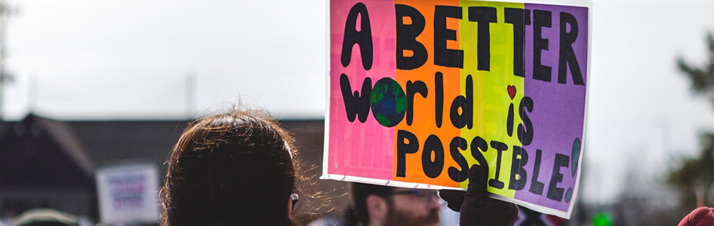 Sign reading "A beter world is possible"