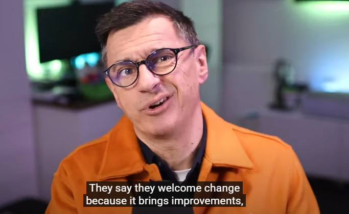 Allister Frost in an Orange Jacket
